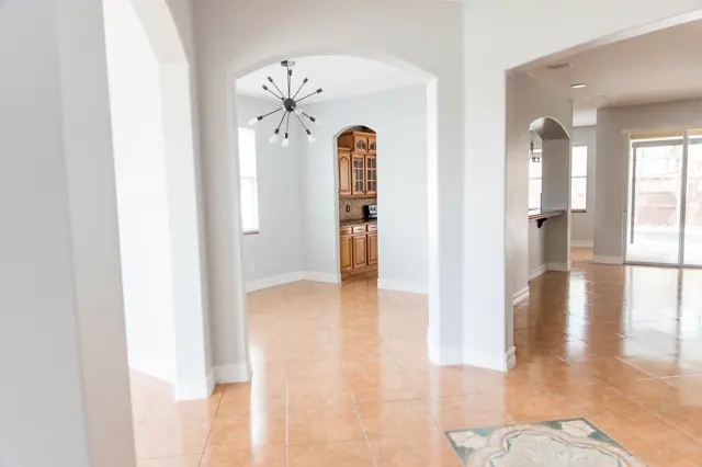 Current condition dining area with modern chandelier.